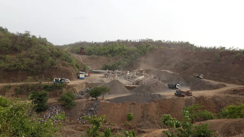 Tippers loading at the quarry, plant and stockpiles behind